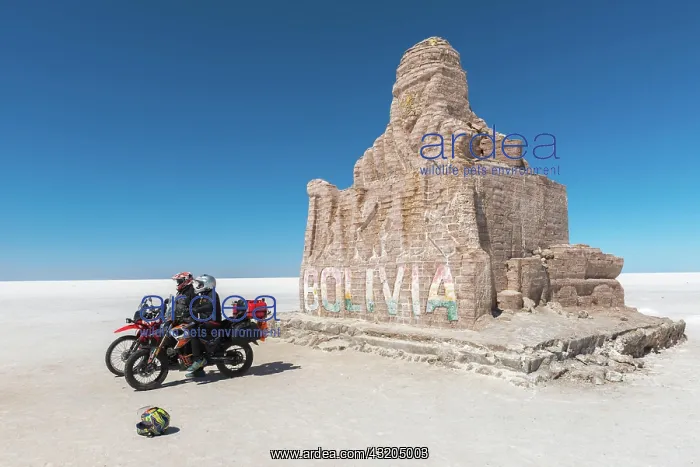 : Tourists, Monument made of salt blocks, Salar de : Tourists, Monument made of salt blocks, Salar de