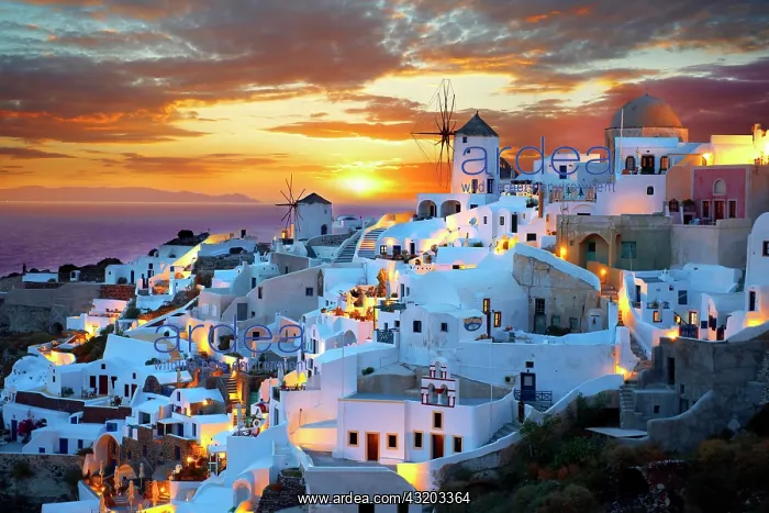 : Townscape with windmills at sunset, Oia, Santorini : Townscape with windmills at sunset, Oia, Santorini