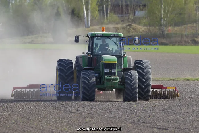 : Tractor ploughing a field - spring - Vaermland : Tractor ploughing a field - spring - Vaermland