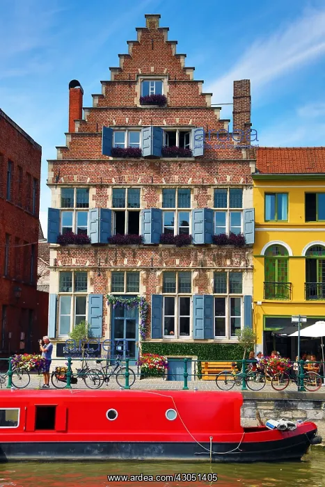: Traditional building and houseboat on a canal, Ghent : Traditional building and houseboat on a canal, Ghent