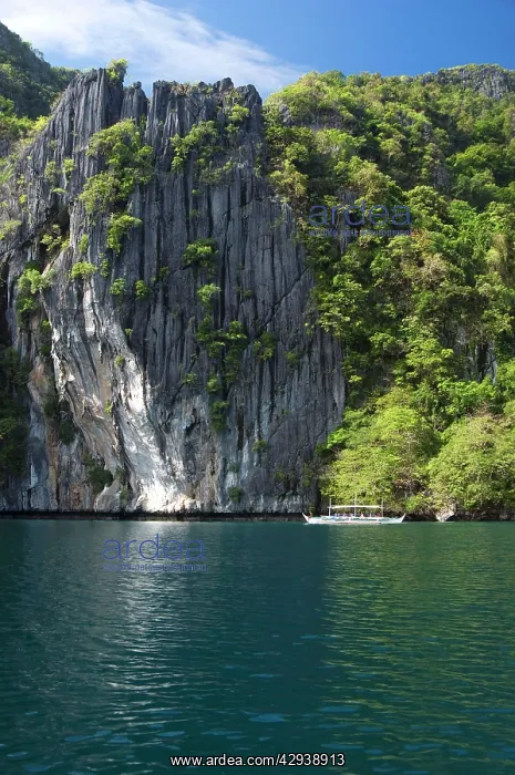 : A traditional Philippine boat with tourists on-board : A traditional Philippine boat with tourists on-board