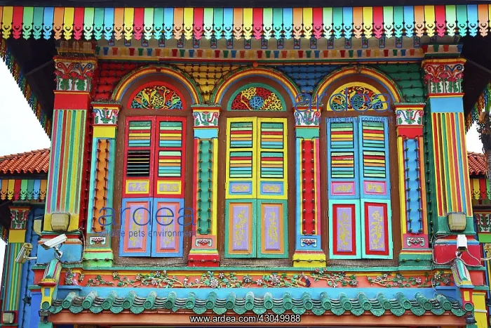 : Traditional rainbow coloured house with colourful shutters : Traditional rainbow coloured house with colourful shutters