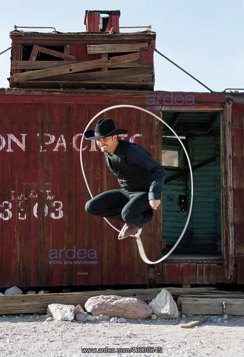 : A travelling lasso artist at a spontaneous performance : A travelling lasso artist at a spontaneous performance
