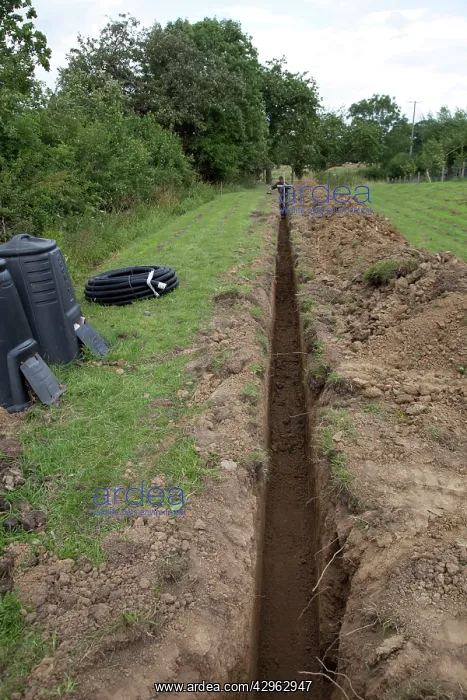 : Trench dug out in field to carry electric cable ducting : Trench dug out in field to carry electric cable ducting
