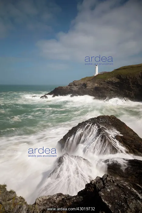 : Trevose Head crashing waves and lighthouse : Trevose Head crashing waves and lighthouse
