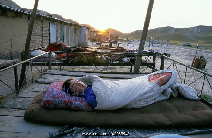 : Turmen - a family sleeps outside on plank-beds - sunrise : Turmen - a family sleeps outside on plank-beds - sunrise