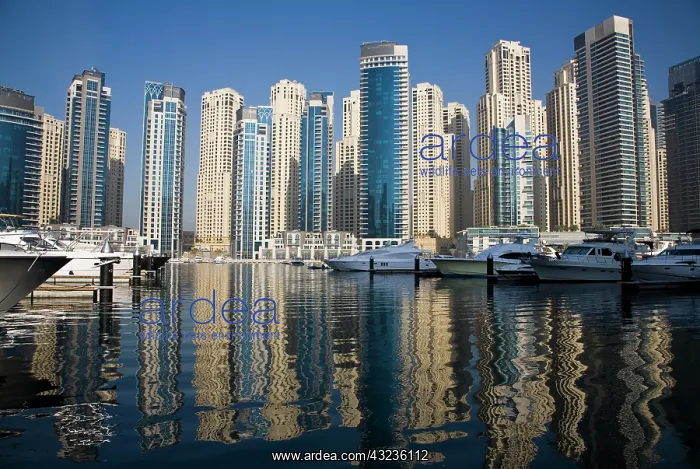 : UAE, Dubai. Marina towers with boats at : UAE, Dubai. Marina towers with boats at