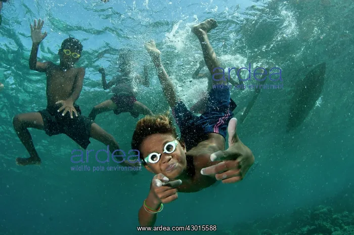 : Underwater boys wearing goggles playing in the water : Underwater boys wearing goggles playing in the water