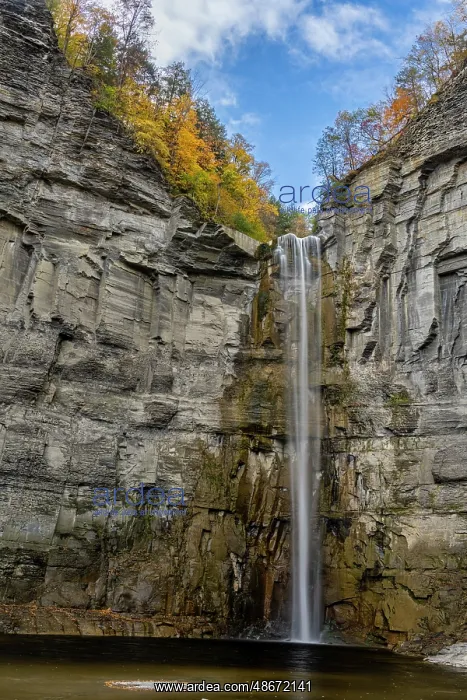 : USA, New York. Fall foliage and Taughannock Falls at State : USA, New York. Fall foliage and Taughannock Falls at State