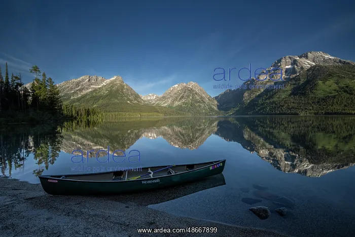 : USA, Wyoming. Canoe and Mountains seen from Leigh Lake : USA, Wyoming. Canoe and Mountains seen from Leigh Lake