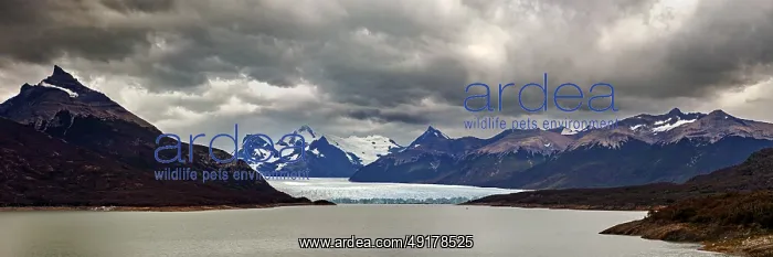: Vast, dramatic landscape in a panoramic format with glaciers and clouds over the horizon : Vast, dramatic landscape in a panoramic format with glaciers and clouds over the horizon