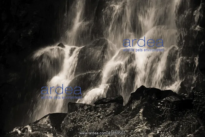 : Vaucoux waterfall cascades gracefully over dark rocks : Vaucoux waterfall cascades gracefully over dark rocks