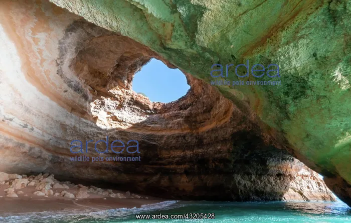 : A view of the inside of the Benagil Cave on the : A view of the inside of the Benagil Cave on the
