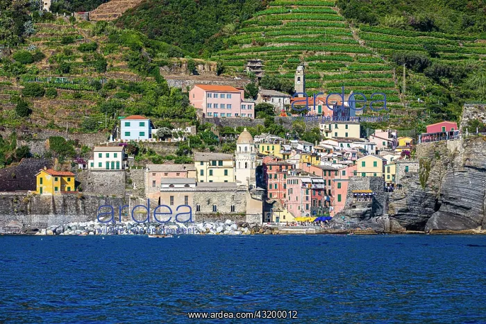 : The village of Vernazza with its churches and pastel-coloure : The village of Vernazza with its churches and pastel-coloure