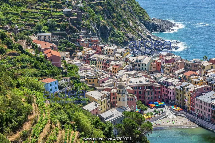 : The village of Vernazza with its pastel-coloured : The village of Vernazza with its pastel-coloured