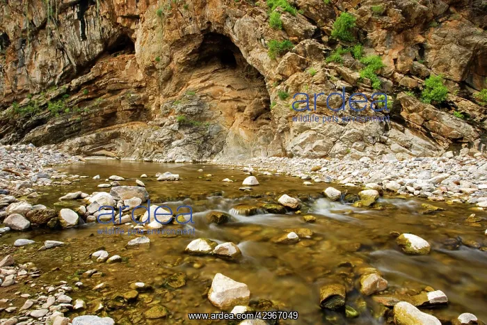 : Water flows through a rock strewn valley in the : Water flows through a rock strewn valley in the