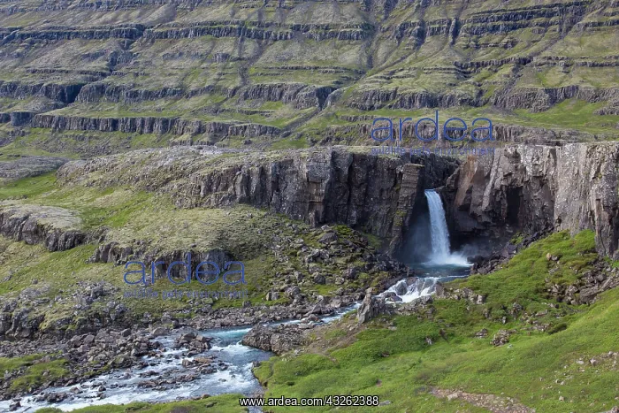: Waterfall Folaldafoss in the mountains of Fossarfell : Waterfall Folaldafoss in the mountains of Fossarfell