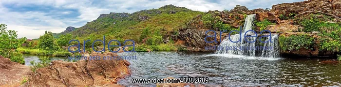 : Waterfall and lakes with mountains in background : Waterfall and lakes with mountains in background