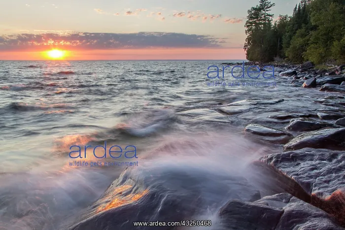 : Waves crash at sunset on Devils Island in : Waves crash at sunset on Devils Island in