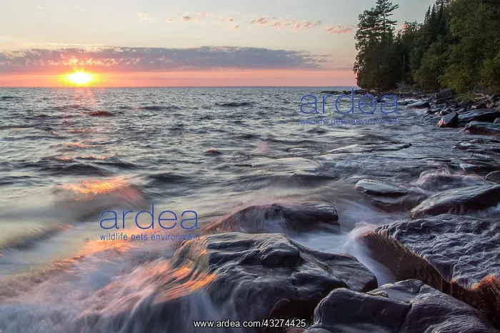 : Waves crash at sunset on Devils Island in : Waves crash at sunset on Devils Island in