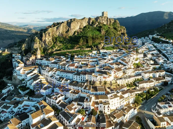 : The White Town of Zahara de la Sierra below a Moorish : The White Town of Zahara de la Sierra below a Moorish