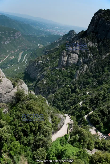: A winding narrow road leads from the valley : A winding narrow road leads from the valley