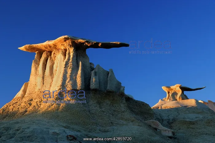 : The Wings - eroded clay sculptures with rocks balanced : The Wings - eroded clay sculptures with rocks balanced