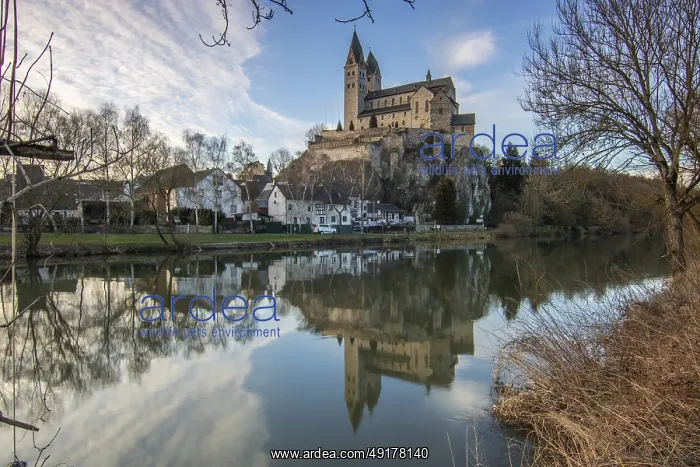 : A winter landscape at sunrise. Lots of nature and a large church on a rock : A winter landscape at sunrise. Lots of nature and a large church on a rock