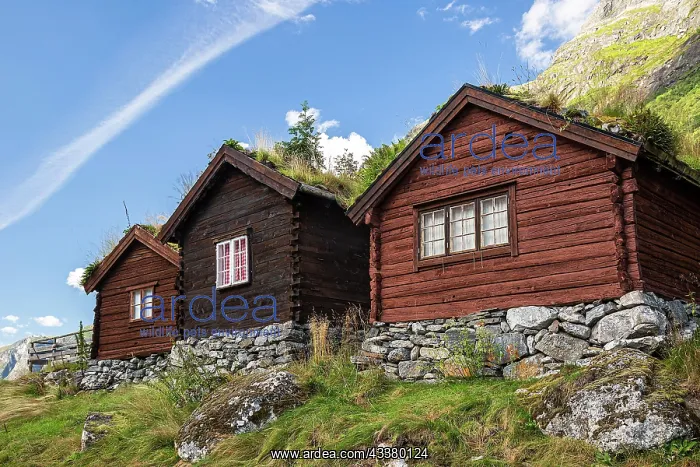 : Three wooden huts stand on a mountain in Norway : Three wooden huts stand on a mountain in Norway