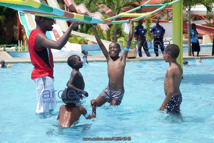  : Young Kenyan boys playing on suspended ladder in