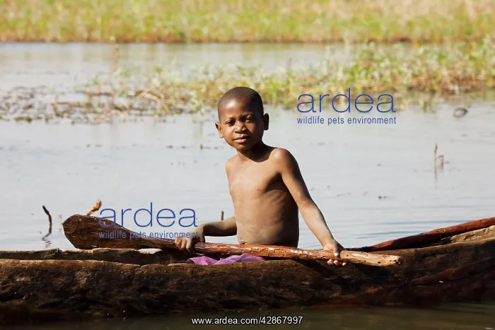 : Zambia - Tonga boy in a fishing boat at the shore : Zambia - Tonga boy in a fishing boat at the shore
