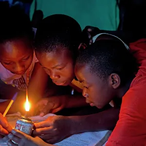 80186925 African children trying to read book with 80186925 African children trying to read book with