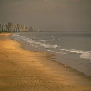 Australia - Walkers on Mermaid Beach at dawn with Australia - Walkers on Mermaid Beach at dawn with