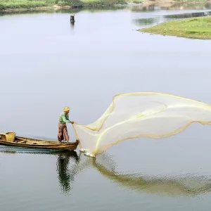 Burmese Fishermen throwing a fishing net
