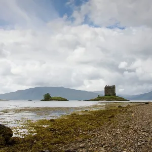 Castle Stalker - atmospheric landscape in the Scottish Castle Stalker - atmospheric landscape in the Scottish