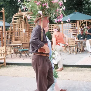 FLOWER SHOW - Hampton Court, man with flowers