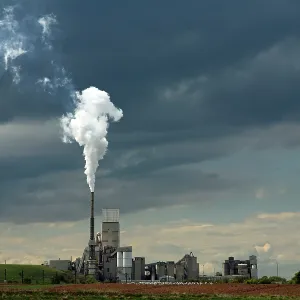 Industrial Site - smoke spewing from the chimney Industrial Site - smoke spewing from the chimney