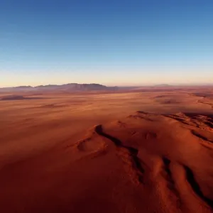 Namibia - Edge of the red sand dunes of the Namib desert Namibia - Edge of the red sand dunes of the Namib desert