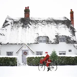 snowy cottage santa claus