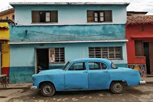 1950s: 1950's era antique car and street scene