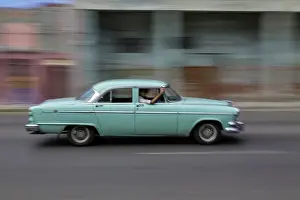 1950s: 1950's era car in motion, Havana, Cuba