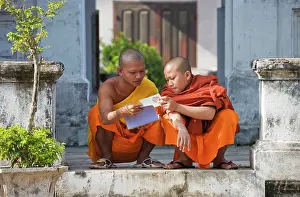 Monks: 2 Buddhist novices at leisure in the Buddhist monastery