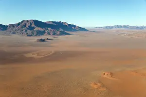 Isolation: 80183570 Arid Desert Plains - and isolated mountain