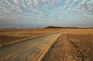 Isolation: 80183576 Gravel Road - in an arid plain with isolated