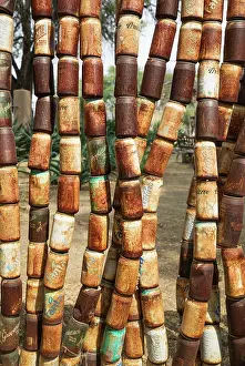 Made: 80183583 Fence - made of old rusty cans in the garden