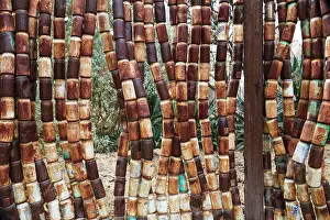 Made: 80183584 Fence - made of old rusty cans in the garden
