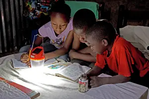 Powered: 80186927 African children studying school book with