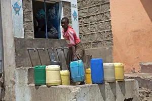 Containers: 80186931 Villagers with containers collecting safe