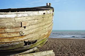 Shingle: 80190148 Boat - old wooden boat on shingle shore