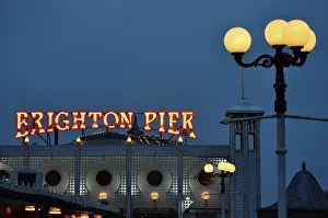 Brighton: 80190149 Brighton Pier - illuminated sign at dusk